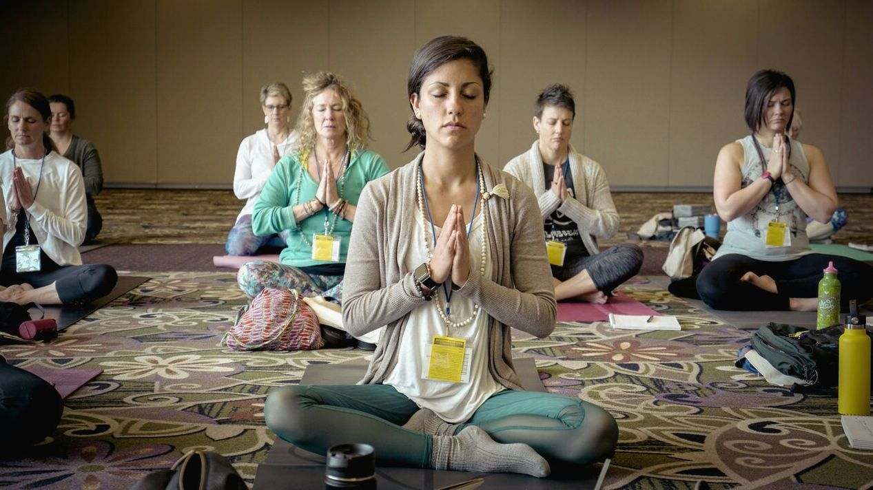Instructor demonstrating pose